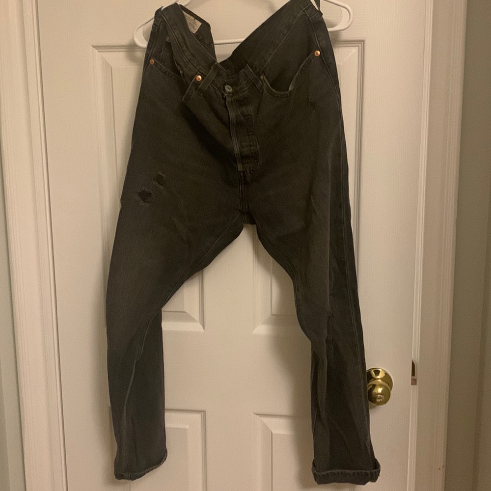 Black ripped Levi’s 501 jeans